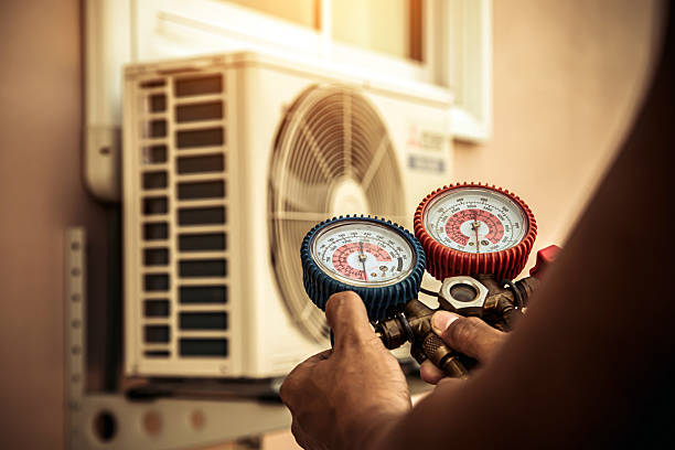 Professional Air Conditioning Service technician working in Guilford, IN